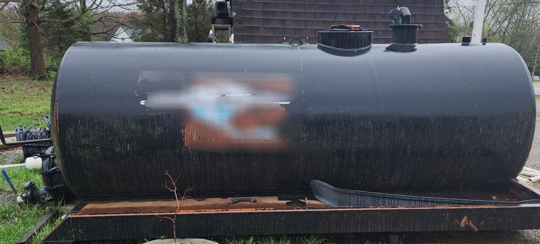 1800 gallon steel tank with bullet ends, side boxes, secondary, both, pump and dump valves. READY TO SET AND WORK.