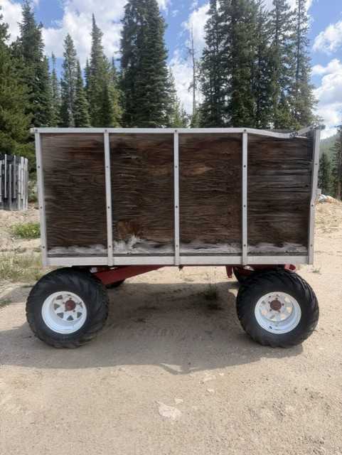 Red four wheel on mountain wagon/trailer — photo 3