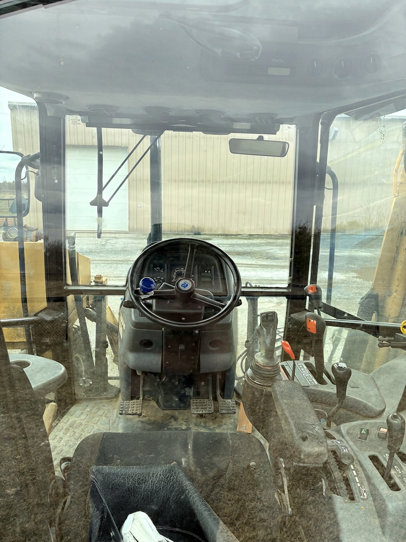 NEW HOLLAND TS110 UTILITY TRACTOR WITH TIGER BOOM MOWER AND QUICKE 3560 FRONT END LOADER
